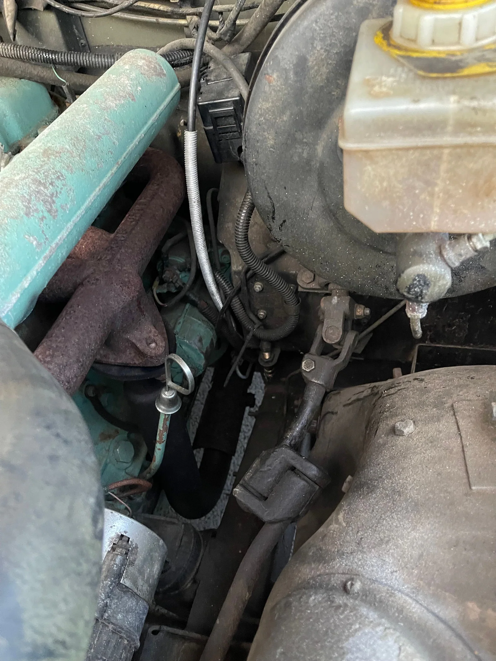 Close-up of the engine bay, brake servo and exhaust manifold