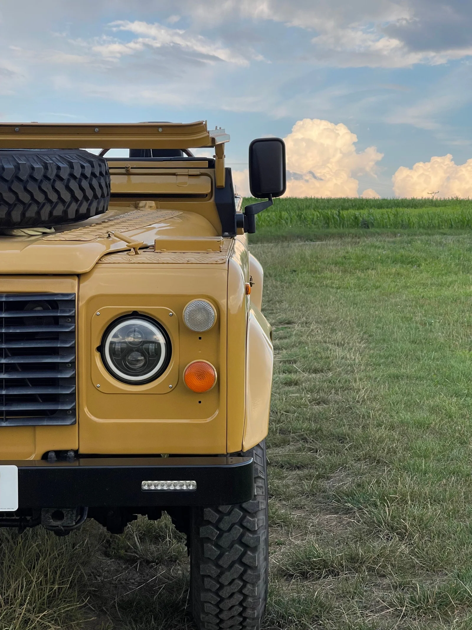 Close-up of the Defender headlamp, indicator and front wing