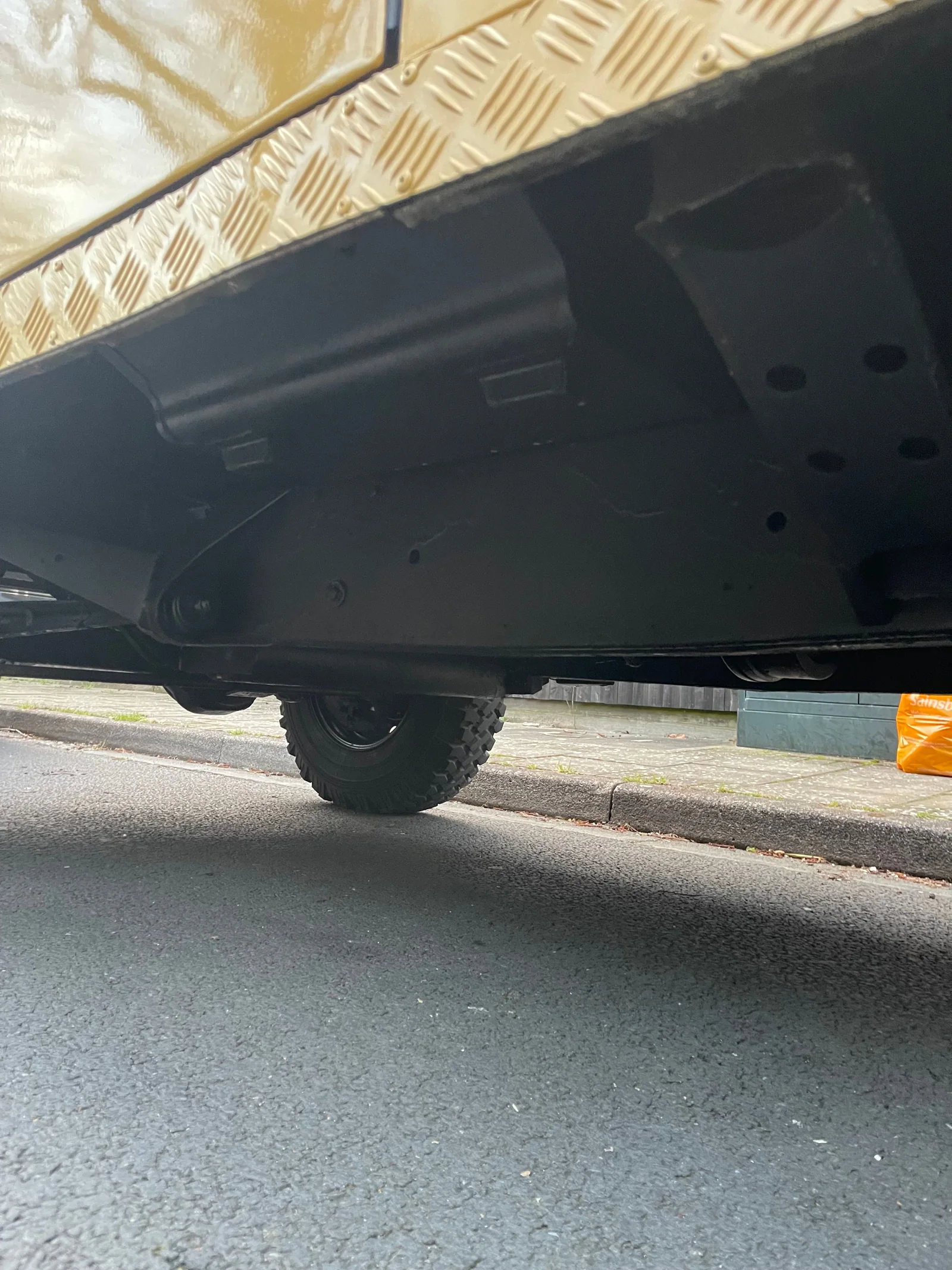 Side view of the undersealed Defender chassis and body floor
