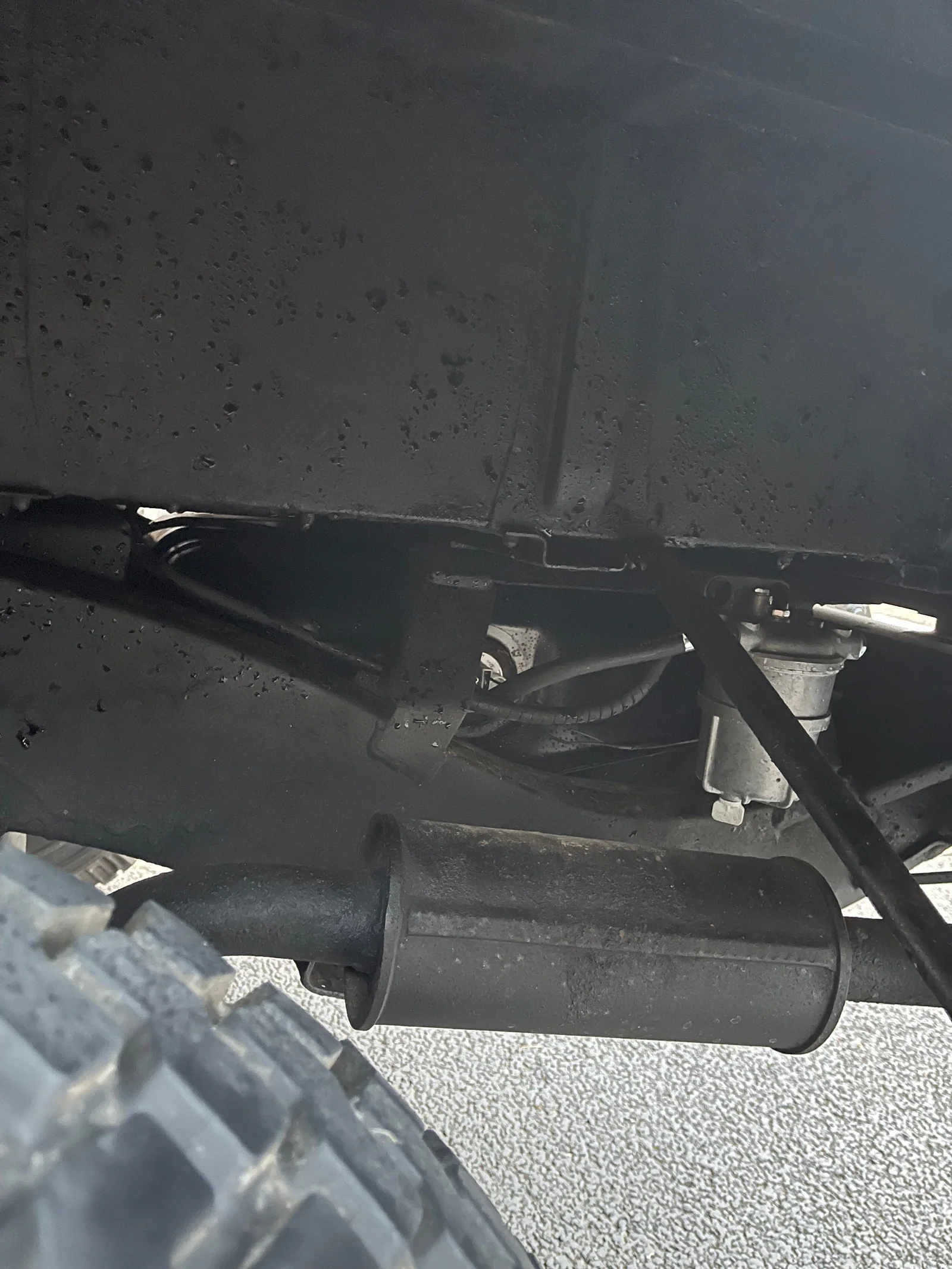 Defender underbody detail showing exhaust and fuel-system components
